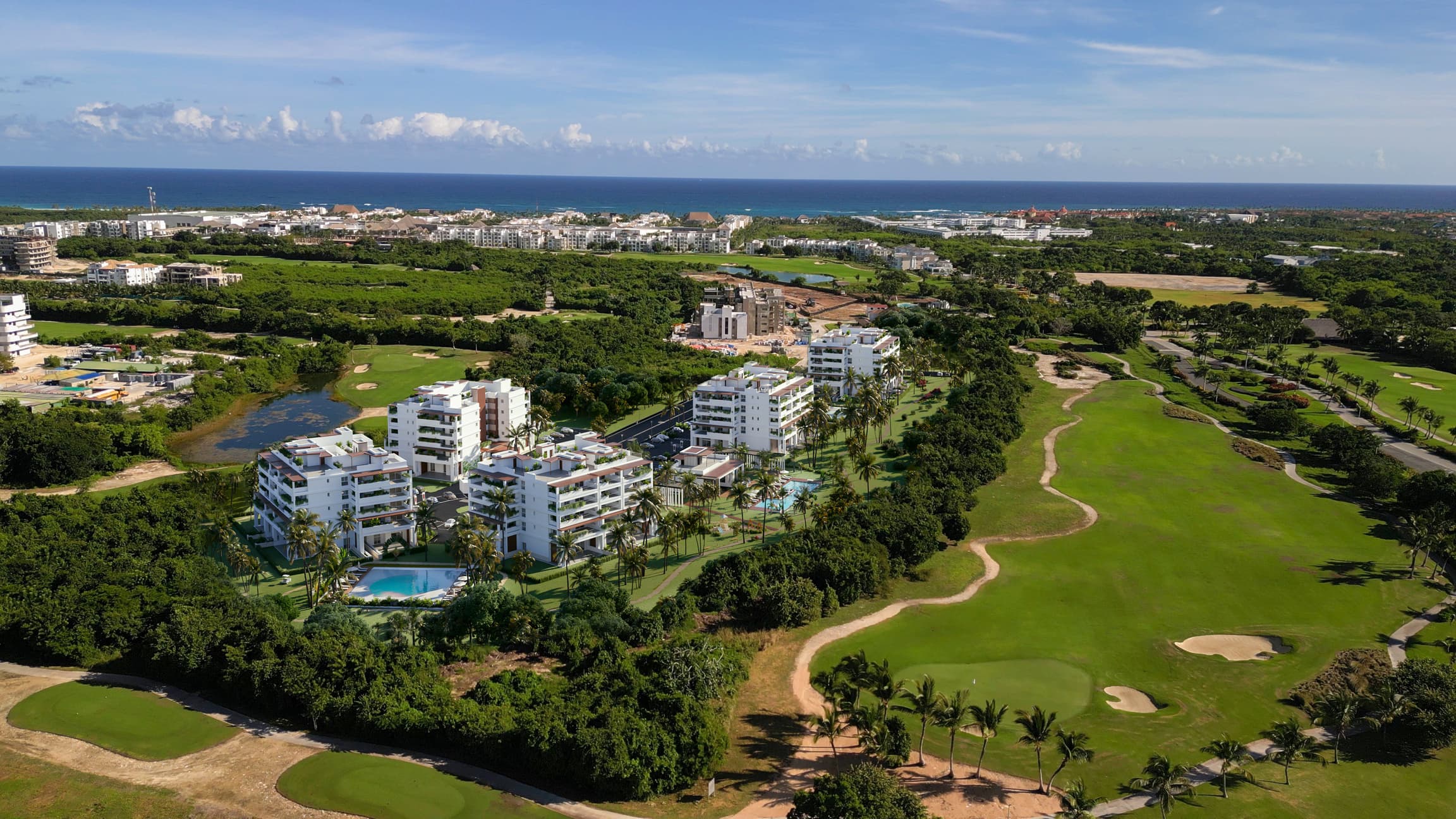 Aerial view of the Baycana development within the Cana Bay golf community and coastline