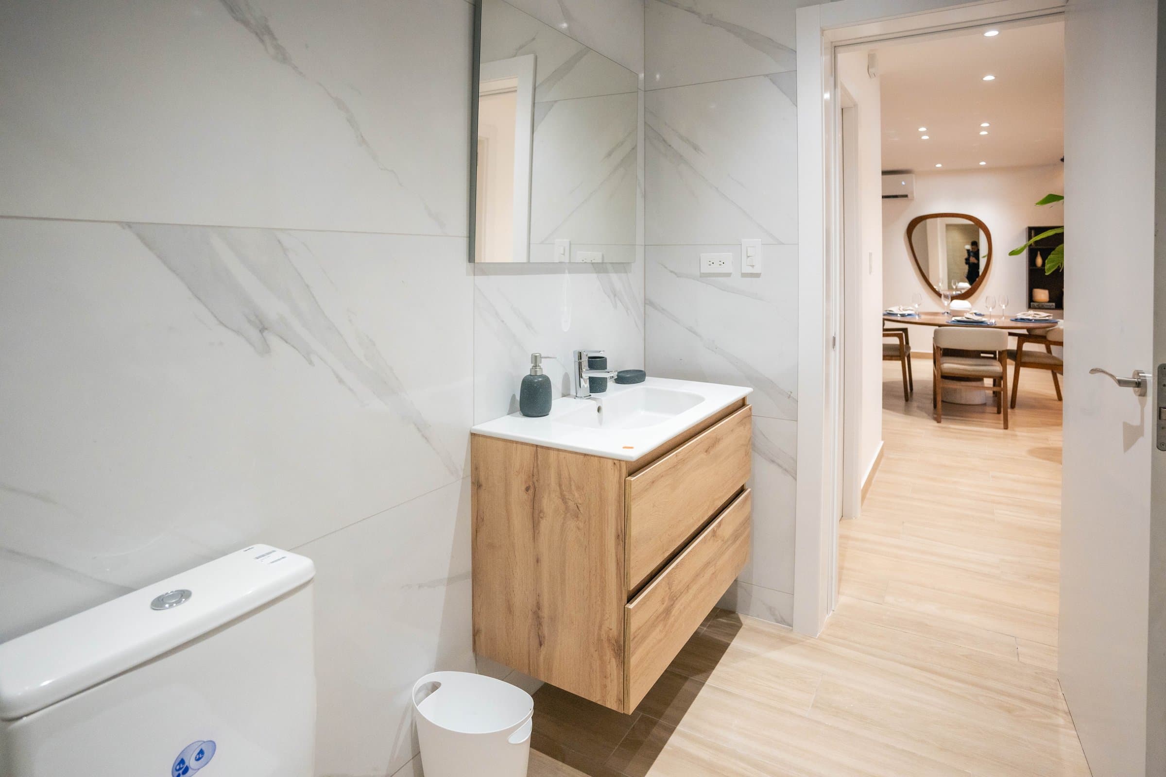 Bathroom with timber vanity and marble-look tiling